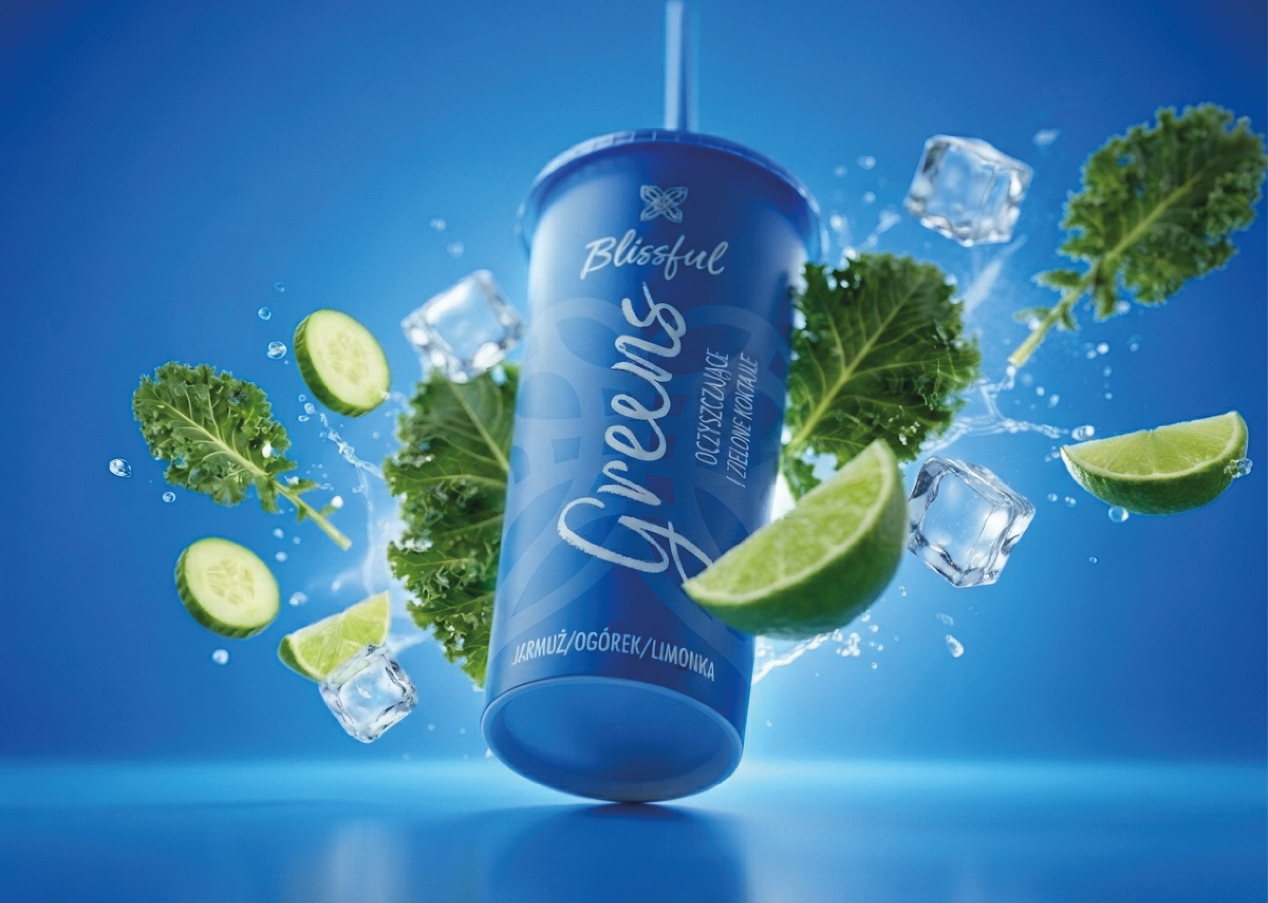 Blue beverage bottle labeled “Blissful” surrounded by kale, cucumber, lime, ice, and splashing water.
