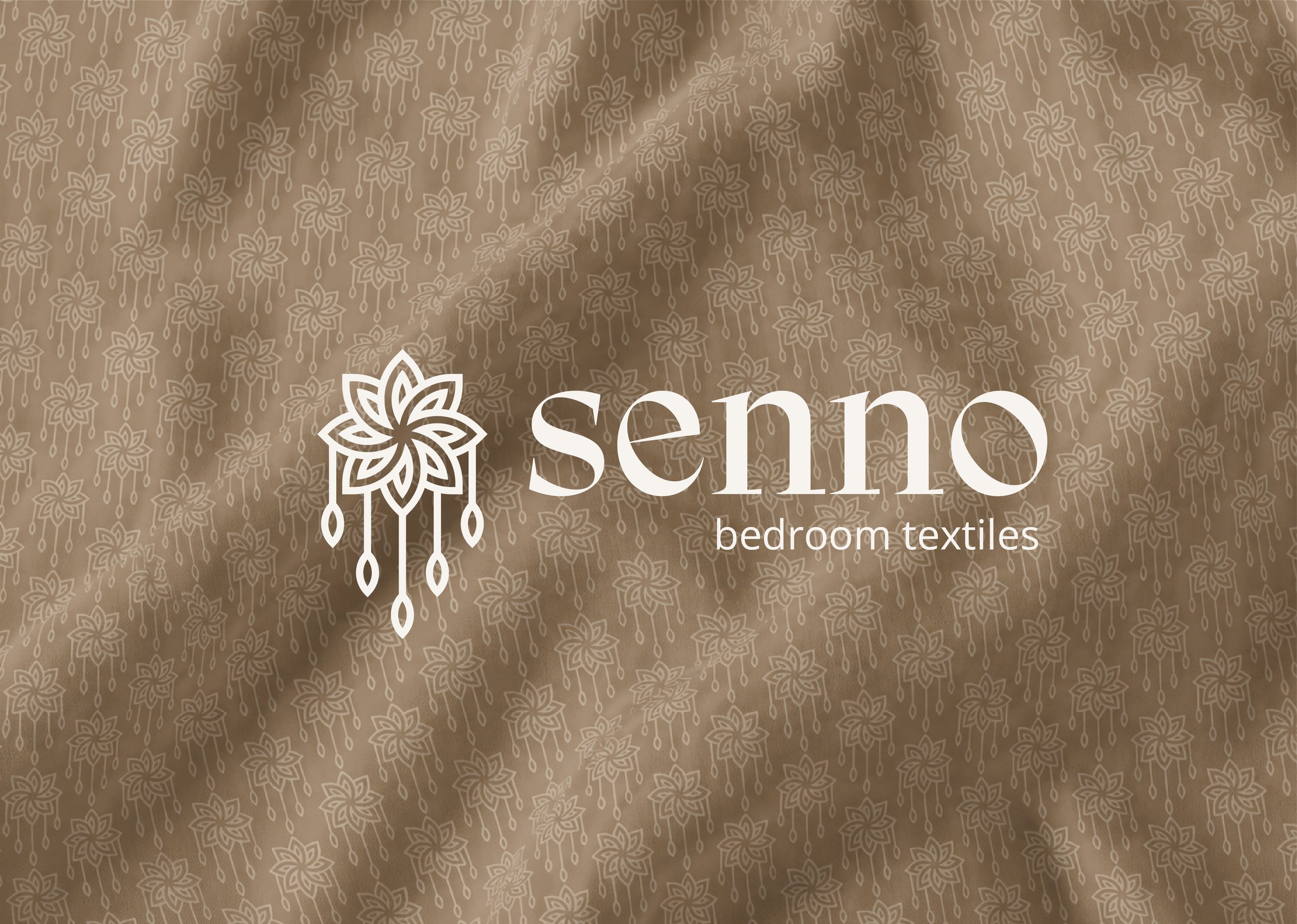 White “senna bedroom textiles” logo over a muted olive floral-and-teardrop textile pattern.