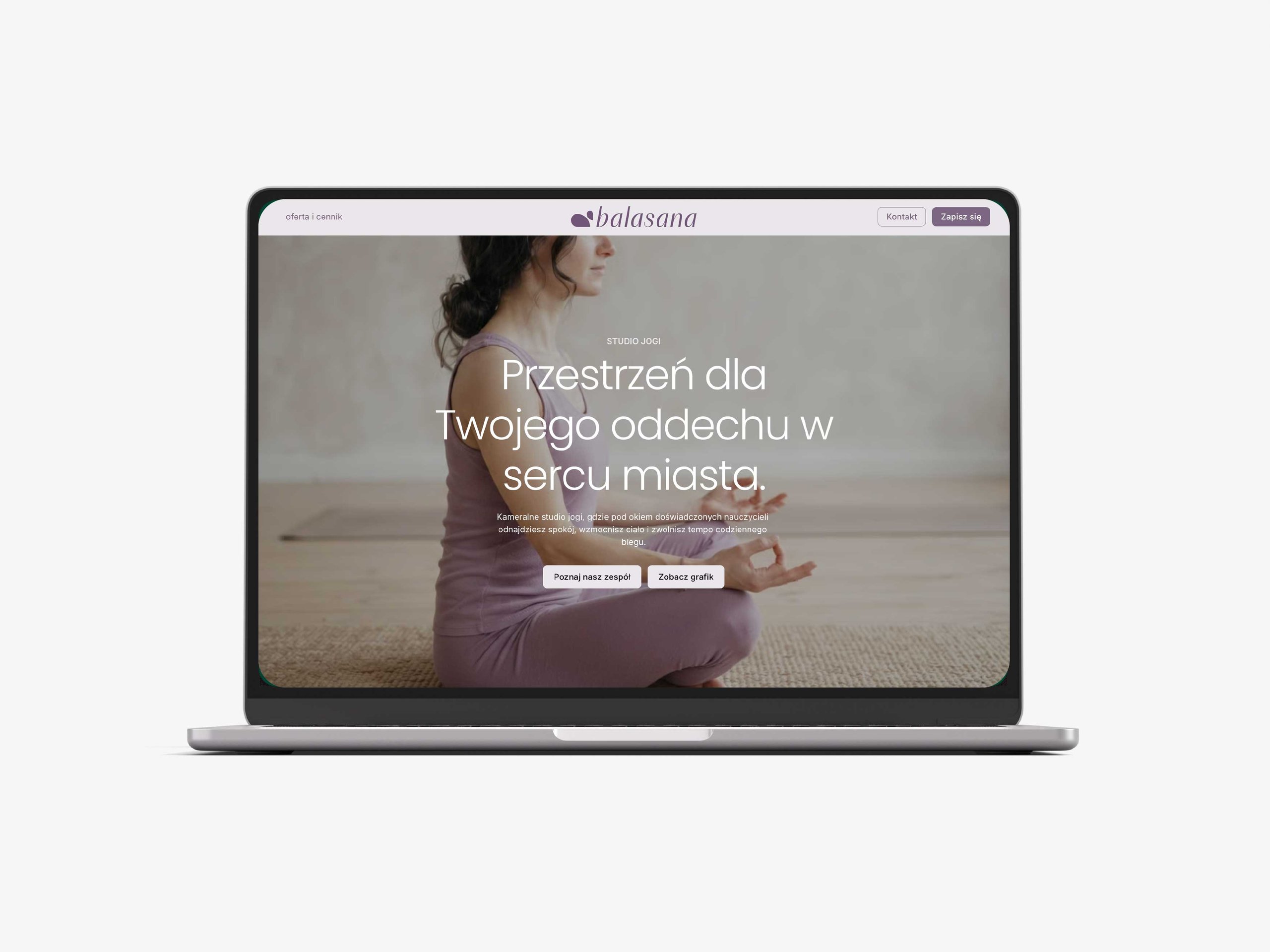 Laptop displays a Polish yoga studio website with a seated woman, headline, logo, and navigation buttons.